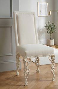 Art. 1873/S, Silla acolchada, con patas de madera perforada y tallada.